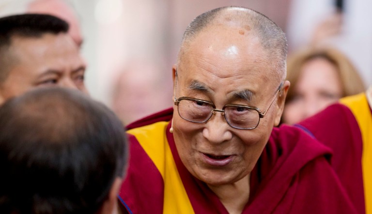 Tibetan spiritual leader the Dalai Lama arrives for an event.