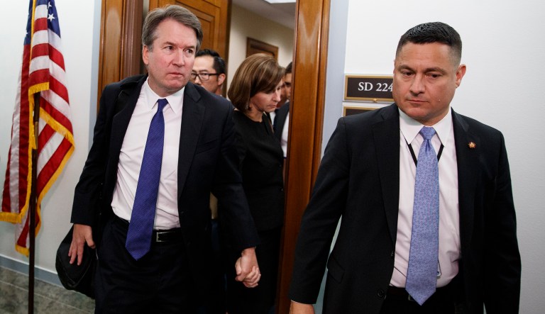 Brett Kavanaugh, President Donald Trump's Supreme Court nominee, and his wife Ashley Estes Kavanaugh, hold hands as they leave a holding room after a Senate Judiciary Committee hearing on Capitol Hill in Washington, Thursday, Sept. 27, 2018.