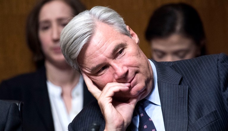 Sen. Sheldon Whitehouse, D-R.I., listens during a hearing. 