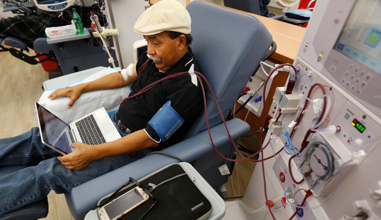 In this photo taken Monday, Sept. 24, 2018, Adrian Perez undergoes dialysis at a DaVita Kidney Care clinic in Sacramento, Calif. If approved by voters in November, Proposition 8, would limit dialysis clinics' profits.