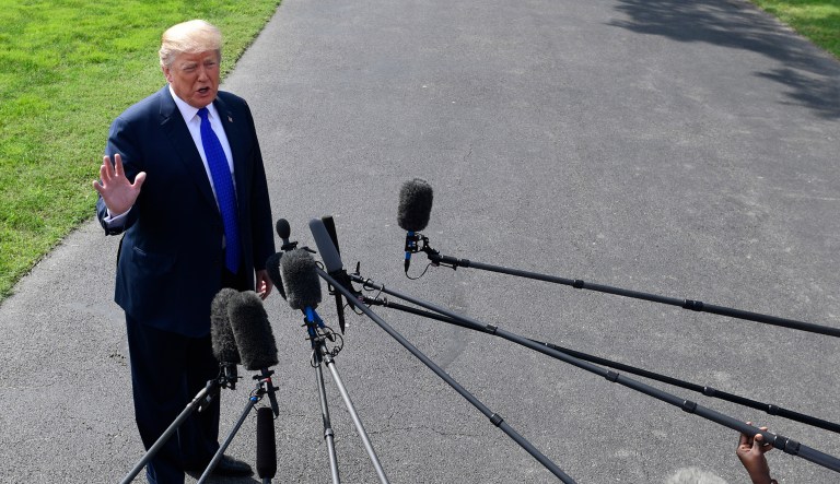 President Donald Trump talks with reporters on the South Lawn of the White House in Washington, Tuesday, Oct. 2, 2018, as he heads to Pennsylvania.