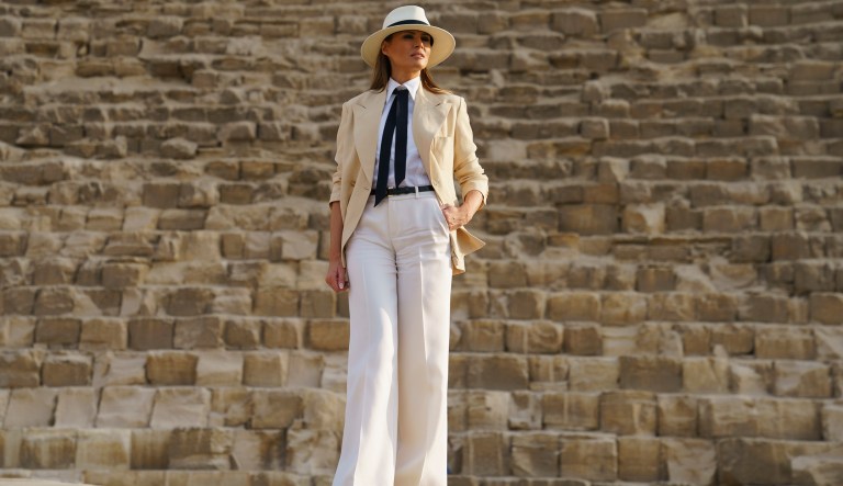 First lady Melania Trump pauses for photographs as she visits the historical site of the Giza Pyramids in Giza, near Cairo, Egypt. Saturday, Oct. 6, 2018. First lady Melania Trump is visiting Africa on her first big solo international trip.