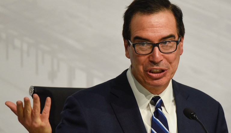 ILE - In this July 22, 2018 file photo, U.S. Treasury Secretary Steven Mnuchin speaks during a news conference at the G20 meeting of Finance Ministers and Central Bank governors in Buenos Aires, Argentina.  The Treasury Department has issued new rules on foreign investments into American companies that will give the government more power to block foreign transactions on national security grounds. The rules represent the latest escalation in an intensifying economic conflict between the United States and China. 