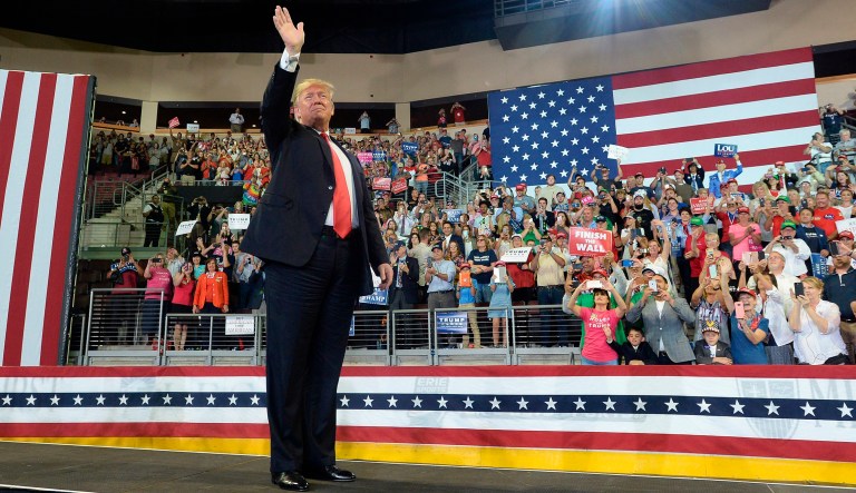 President Donald Trump enters Erie Insurance Arena for a rally in Erie, Pa., Wednesday, Oct. 10, 2018. 