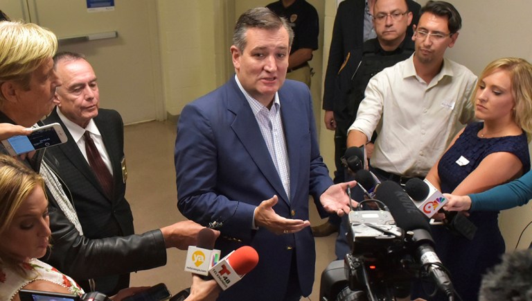 Texas Sen. Ted Cruz talks to the media at a rally.