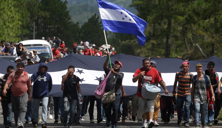Hondurans march in a caravan of migrants moving toward the country's border with Guatemala in a desperate attempt to flee poverty and seek new lives in the United States, in Ocotepeque, Honduras, Monday, Oct. 15, 2018. The group has grown to an estimated 1,600 people from an initial 160 who first gathered early Friday in a northern Honduras city. They plan to try to enter Guatemala on Monday.