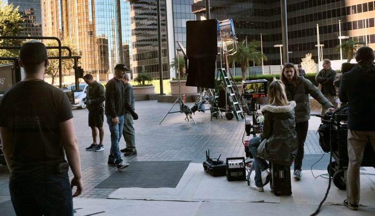 This Wednesday, Oct. 17, 2018 photo shows a film production crew setting up for a Chevrolet car commerical in downtown Los Angeles.