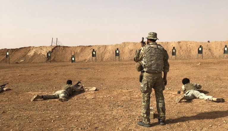 Members of the Maghawir al-Thawra Syrian opposition group receive firearms training from U.S. Army Special Forces soldiers at the al-Tanf military outpost in southern Syria on Monday, Oct. 22, 2018. 