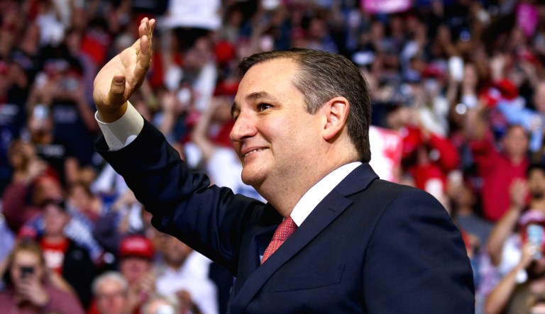 Sen. Ted Cruz, R-Texas, arrives for a campaign rally with President Trump at Houston Toyota Center on Monday.