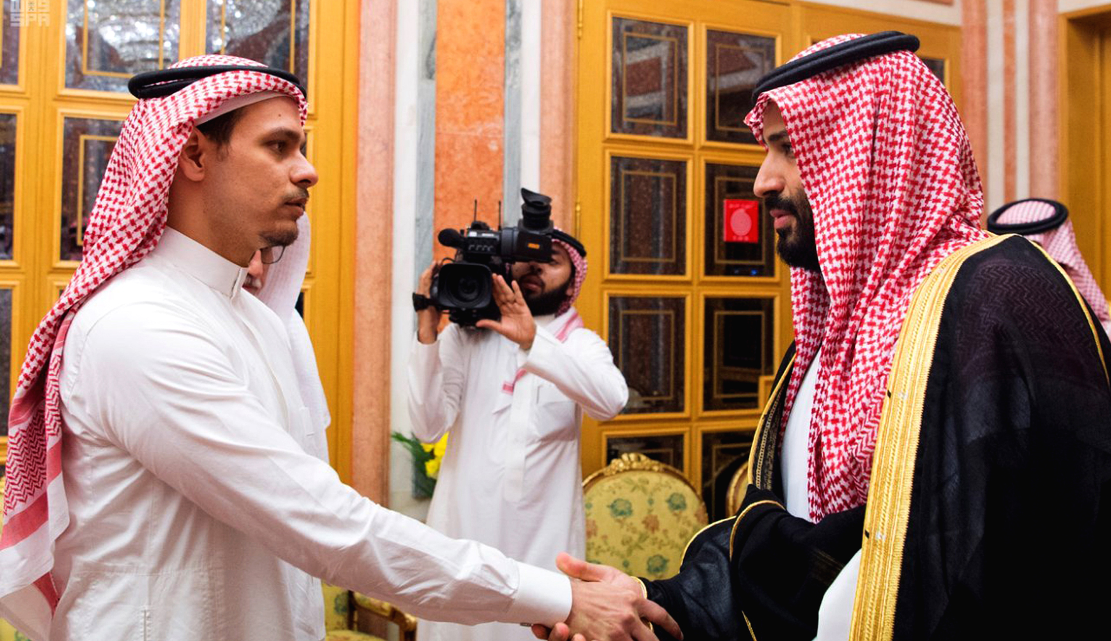 Khashoggi’s sons shake hand of Saudi prince accused of ordering their father’s murder