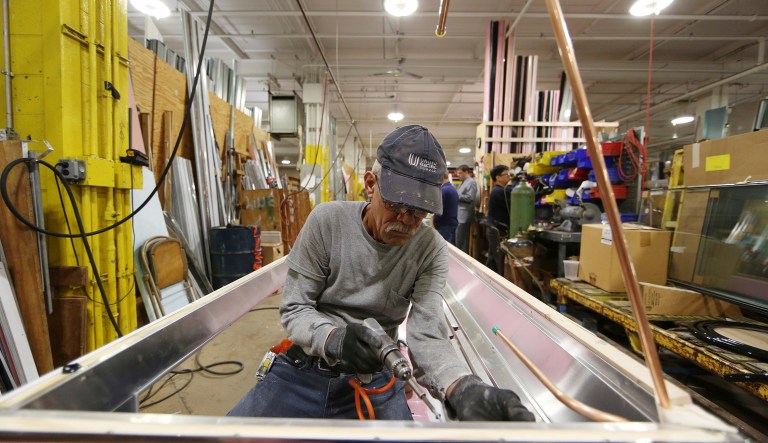 Luis Ramos works at the Howard McCray's commercial refrigeration manufacturing facility in Philadelphia.