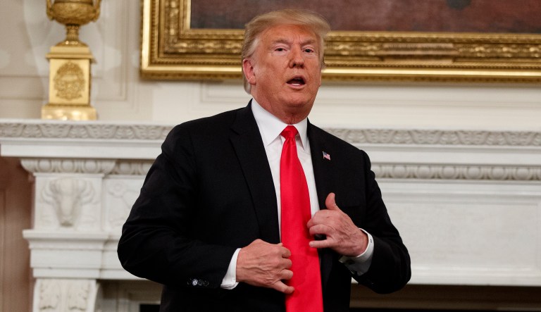 President Trump stands up to leave the "Our Pledge to America's Workers" event in the State Dining Room of the White House, Wednesday, Oct. 31, 2018, in Washington.