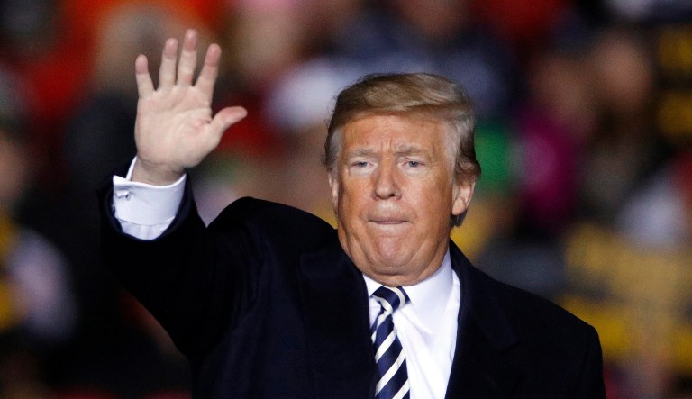 President Trump waves to the crowd during a campaign rally.