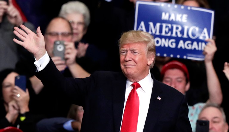 President Trump takes the stage to speak at a campaign rally.