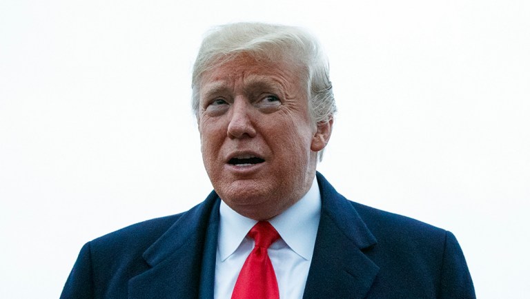 President Trump talks with the media as he arrives on Air Force One.