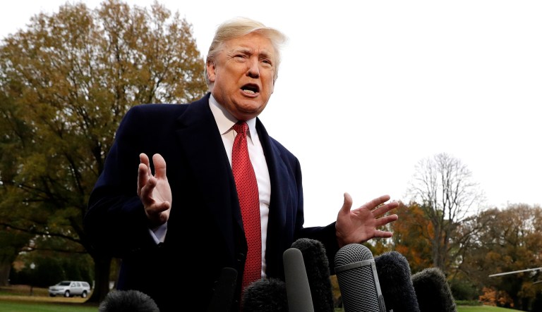 President Trump talks to the media before boarding Marine One on the South Lawn of the White House in D.C.