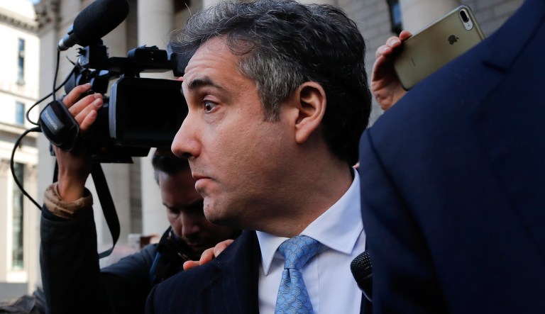 Michael Cohen walks out of federal court, Thursday, Nov. 29, 2018, in New York, after pleading guilty to lying to Congress about work he did on an aborted project to build a Trump Tower in Russia.  Cohen told the judge he lied about the timing of the negotiations and other details to be consistent with Trump's "political message."