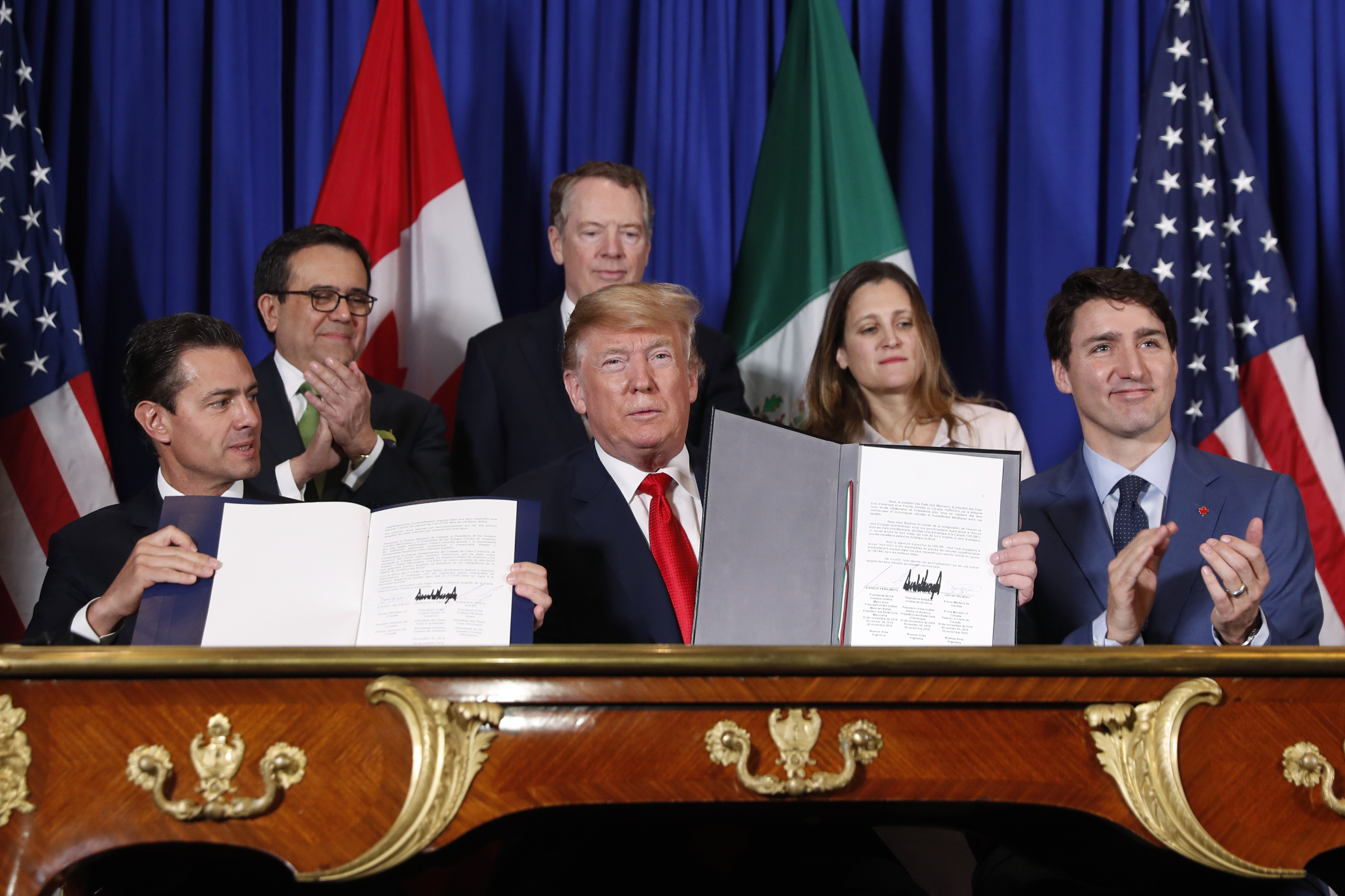 Trump signs NAFTA replacement deal with Mexico, Canada