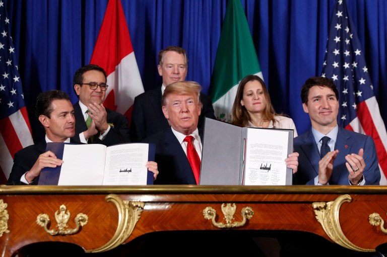 President Donald Trump, Canada's Prime Minister Justin Trudeau, right, and Mexico's President Enrique Pena Neto, left, participate in the USMCA signing ceremony, Friday, Nov. 30, 2018 in Buenos Aires, Argentina. 