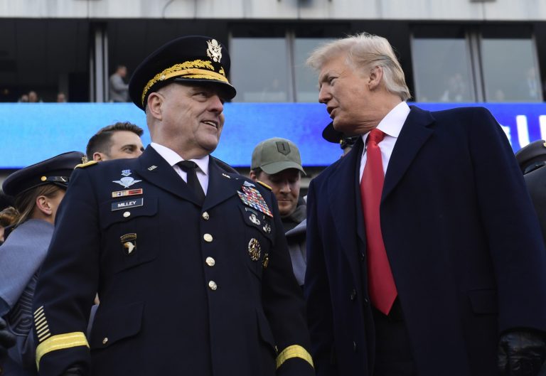 President Trump, right, talks with Army Chief of Staff Gen. Mark Milley, left, during the Army-Navy NCAA college football game in Philadelphia, Saturday, Dec. 8, 2018.