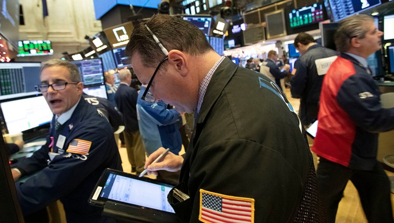 Stock market crashes hit average Americans hardest, not the wealthy Traders work at the New York Stock Exchange.