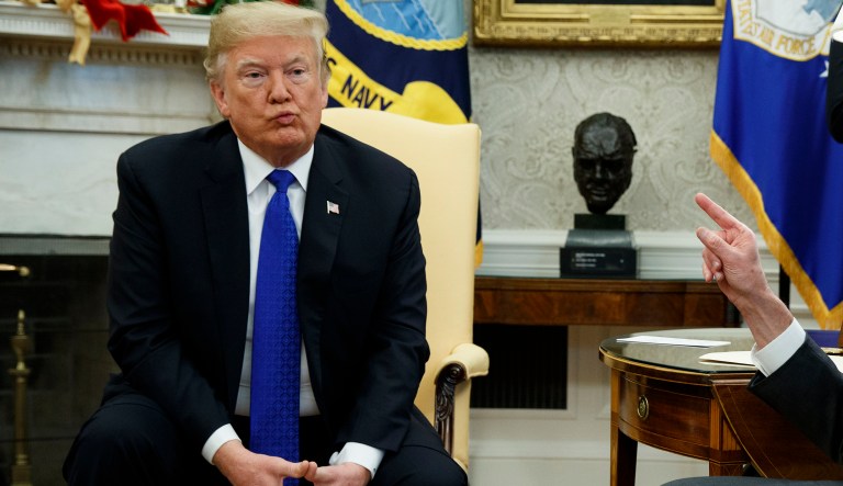 President Donald Trump listens during a meeting with Senate Minority Leader Chuck Schumer, D-N.Y., and House Minority Leader Rep. Nancy Pelosi, D-Calif., in the Oval Office of the White House, Tuesday, Dec. 11, 2018, in Washington.