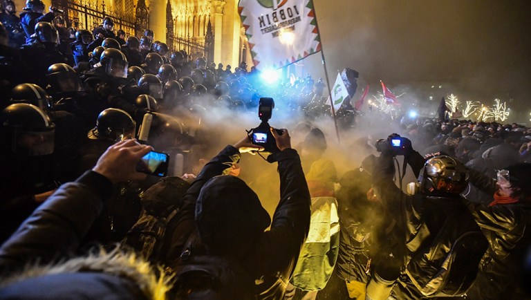 Protesters clash with police during a demonstration against the amendments to the labour code, dubbed "slave law" by oppositional forces.