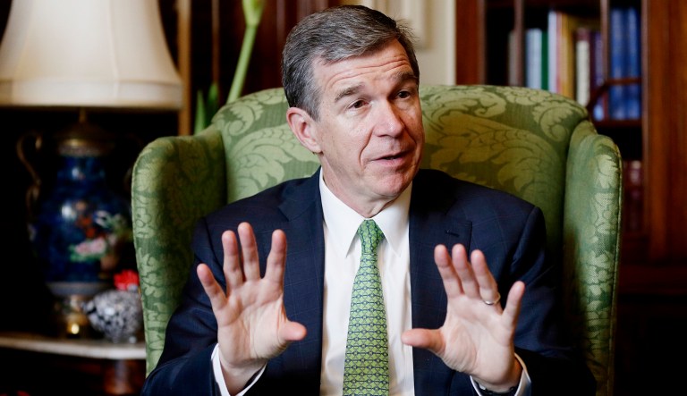 North Carolina Gov. Roy Cooper responds to a question during an interview at the governor's mansion in Raleigh, N.C.