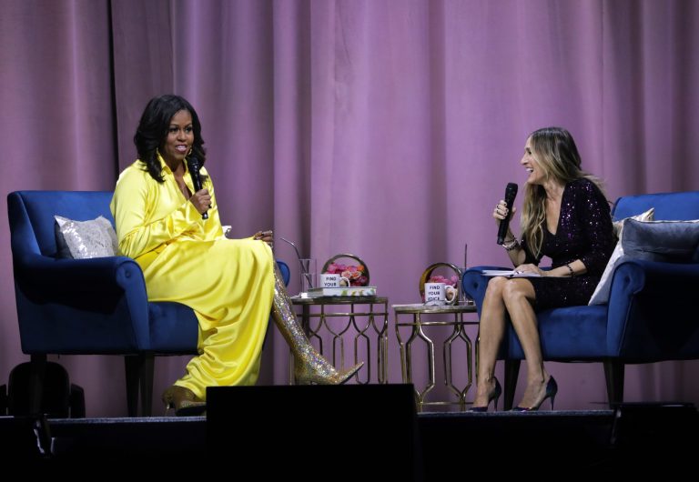 Michelle Obama’s boots: the unabashedly feminine decadence that fashion needed Former first lady Michelle Obama, left, is interviewed by Sarah Jessica Parker during an appearance for her book, "Becoming: An Intimate Conversation with Michelle Obama" at Barclays Center on Wednesday, Dec. 19, 2018, in New York.