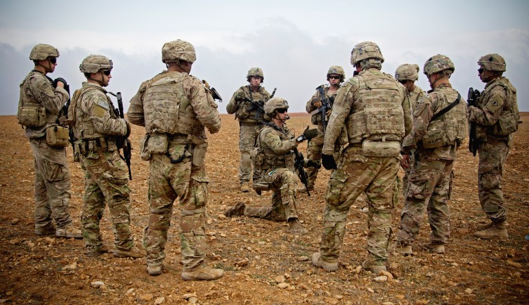 U.S. soldiers gather for a brief during a combined joint patrol rehearsal in Manbij, Syria.