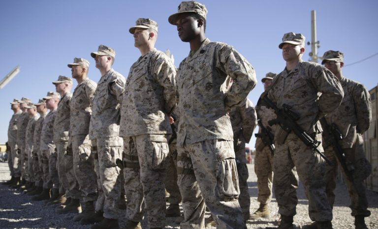 In this Jan. 15, 2018 photo, U.S. Marines stand guard during the change of command ceremony at Task Force Southwest military field in Shorab military camp of Helmand province, Afghanistan. 