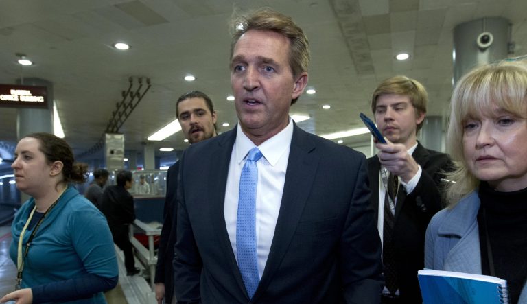 Sen. Jeff Flake, R-Ariz., a member of the Senate Foreign Relations Committee, speaks with reporters at the Capitol in Washington, Friday, Dec. 21, 2018. 