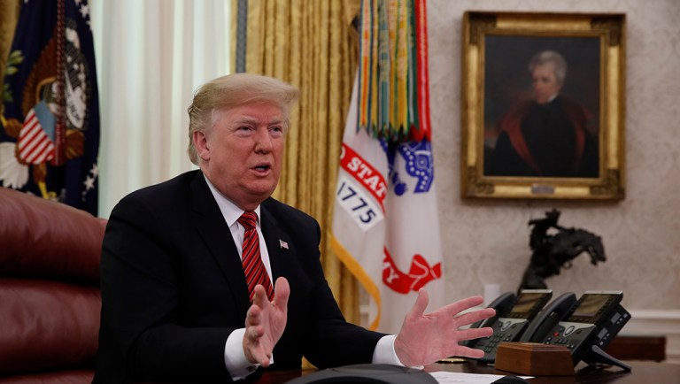 President Trump greets members of the five branches of the military by video conference on Christmas Day.