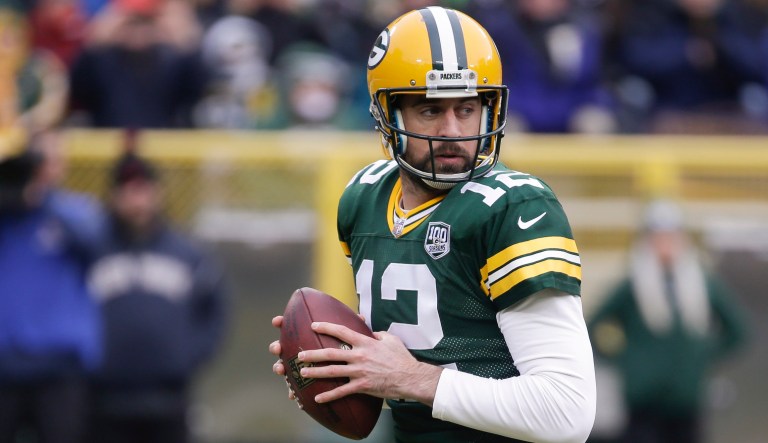 Green Bay Packers' Aaron Rodgers throws during the first half of an NFL football game.