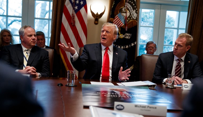 Acting Secretary of the Interior David Bernhardt, left, and acting Secretary of Defense Patrick Shanahan, right, listen as President Trump speaks during a Cabinet meeting at the White House in D.C.