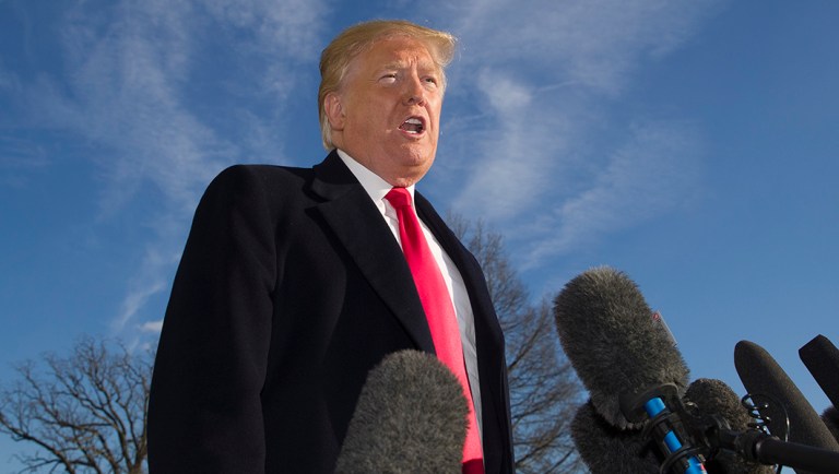 President Donald Trump speaks on the South Lawn of the White House as he walks from Marine One, Sunday, Jan. 6, 2019, in Washington. Trump returned from a trip to Camp David.
