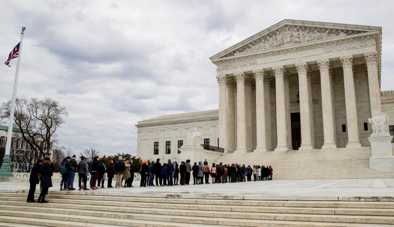 People wait in line to hear arguments before the Supreme Court in D.C.