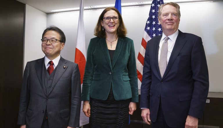 From left, Japanese Minister of Economy, Trade and Industry, Hiroshige Seko, European Commissioner for Trade, Cecilia Malmstrom, and U.S. Trade Representative Robert Lighthizer, pose for media before meeting in Washington, Wednesday, Jan. 9, 2019. 