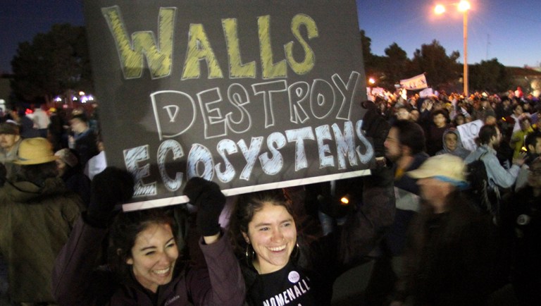 Isa Casillas, left, and Janelle Hernandez, of Las Cruces, N.M., take part in a march and rally outside the El Paso County Coliseum.
