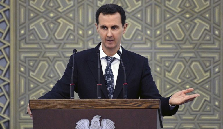 In this photo released by the Syrian official news agency SANA, Syrian President Bashar Assad speak during meeting with heads of local councils from all Syrian provinces, in Damascus, Syria, Sunday, Feb. 17, 2018. 