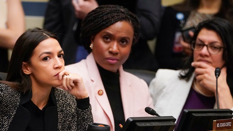 House Oversight and Reform Committee members, from left, Rep. Alexandria Ocasio-Cortez, D-N.Y., Rep. Ayanna Pressley, D-Mass., and Rep. Rashida Tlaib, D-Mich., listen during a committee hearing.