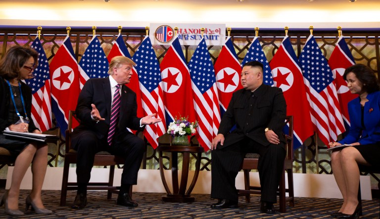 President Donald Trump meets North Korean leader Kim Jong Un, Wednesday, Feb. 27, 2019, in Hanoi, as interpreters look on. 