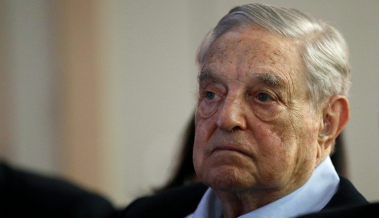In this May 29, 2018 photo George Soros, Founder and Chairman of the Open Society Foundations listens to the conference after his speech entitled "How to save the European Union" as he attends the European Council On Foreign Relations Annual Council Meeting in Paris. 