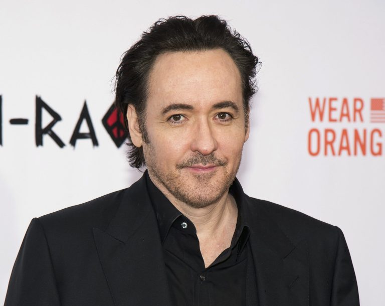 John Cusack attends a premiere.
