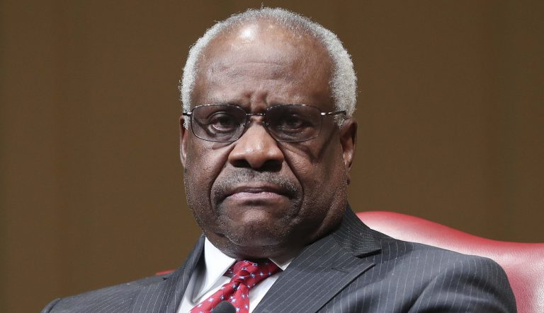 In this Feb. 15, 2018 photo, Supreme Court Associate Justice Clarence Thomas sits as he is introduced during an event at the Library of Congress in Washington. 