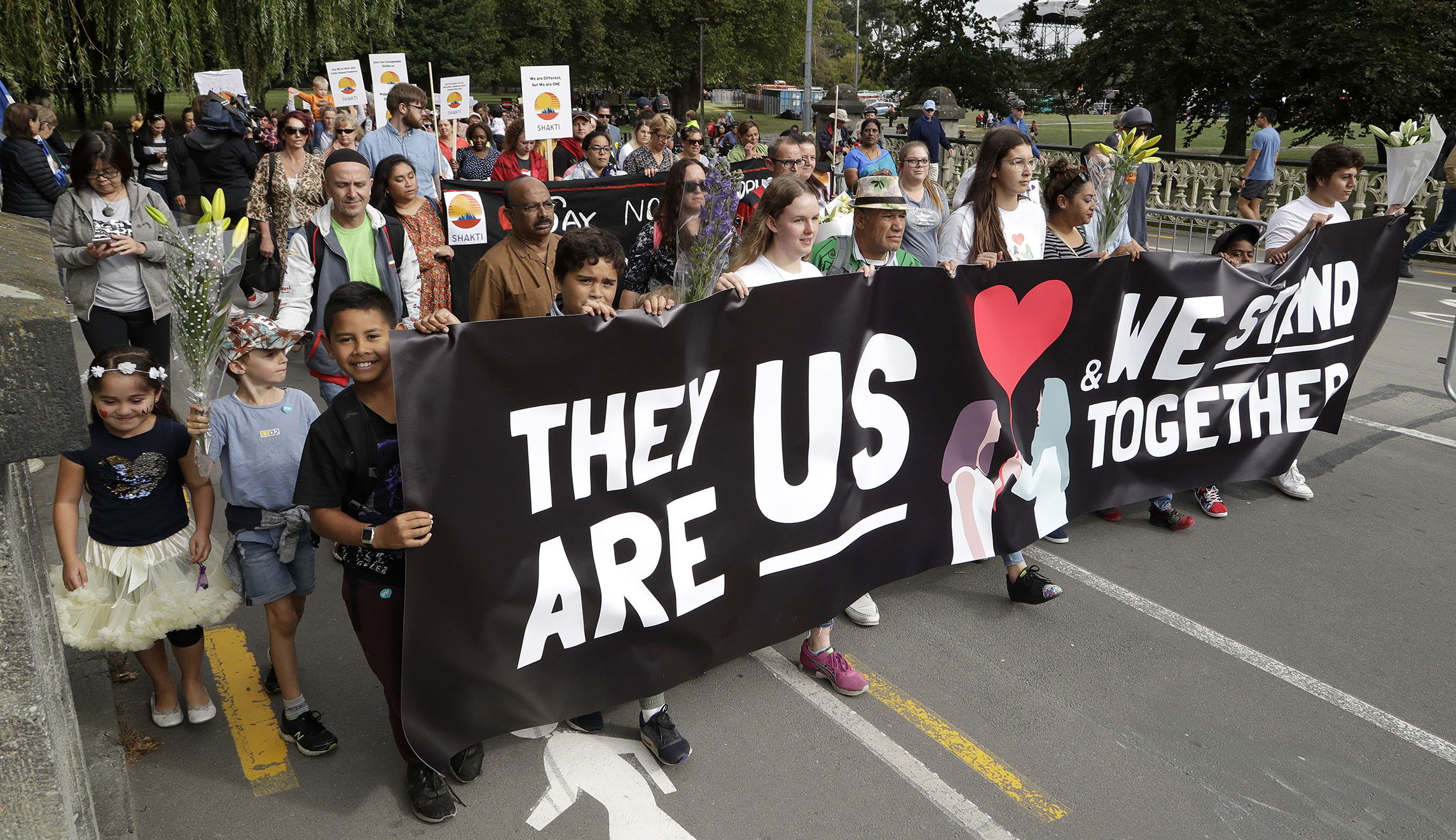 Students and members of the public walk in the "March for Love" following last week's mosque attacks in Christchurch, New Zealand, Saturday, March 23, 2019.