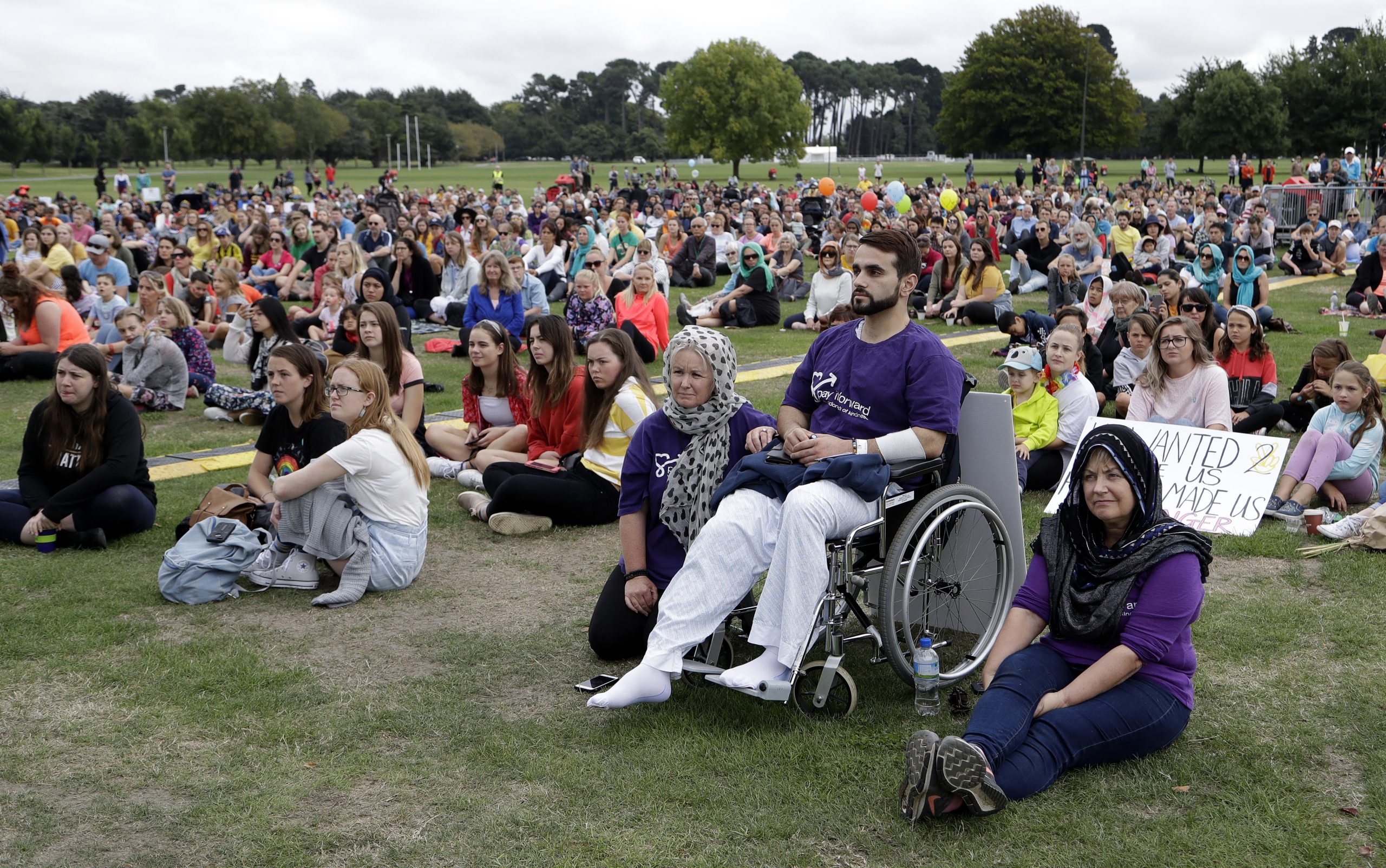 A survivor of last week's shootings attends the "March for Love" event in Hagley park following last week's mosque attacks in Christchurch, New Zealand, Saturday.