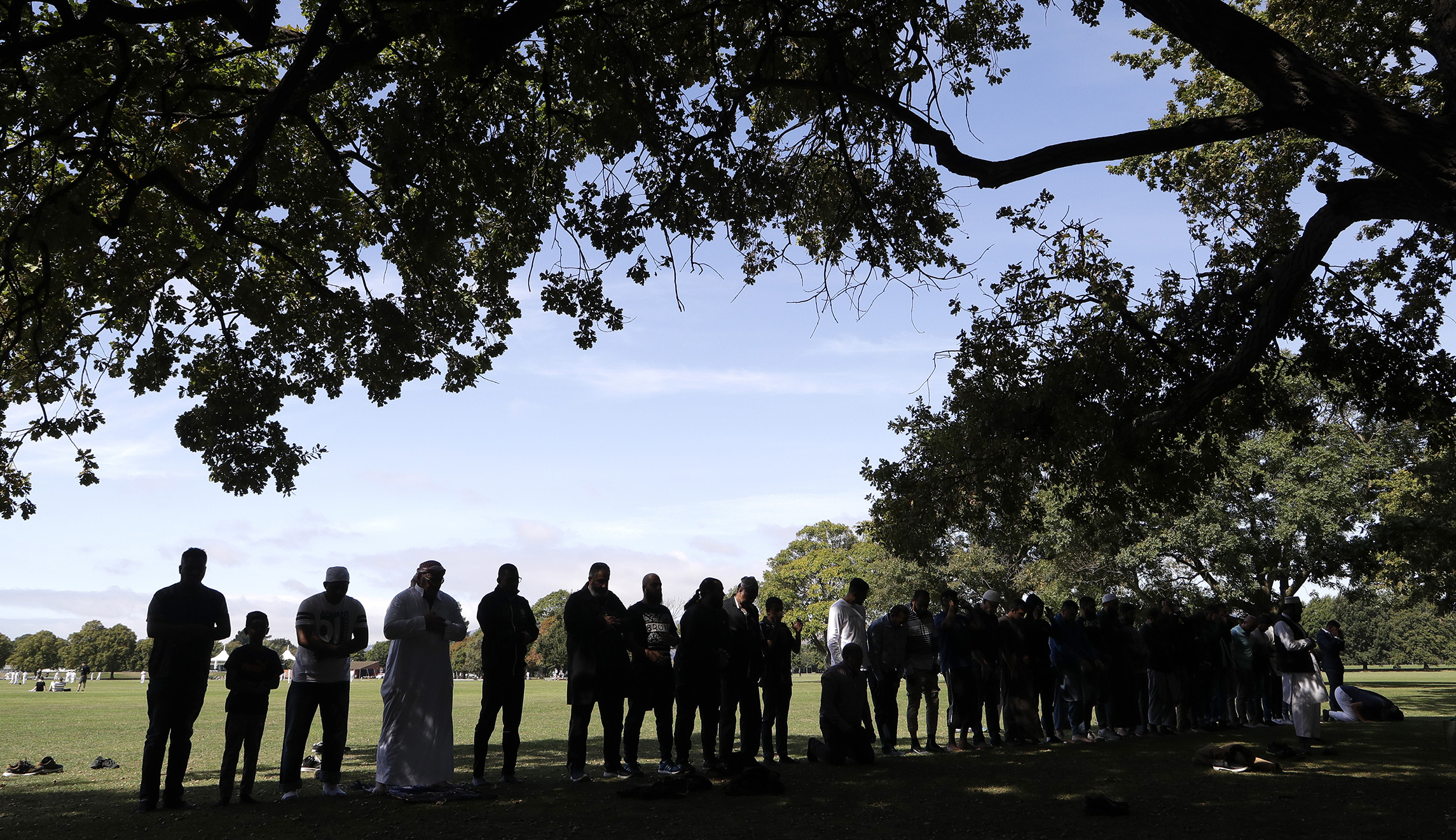Muslim men pray in Hagley Park across the road from the Al Noor mosque following last week's mass shooting in Christchurch, New Zealand.