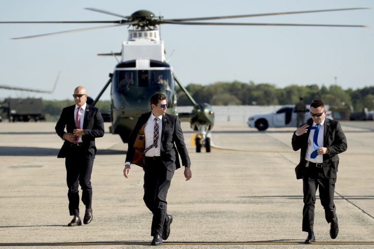 Secret Service agents arrive in a Marine helicopter at Andrews Air Force Base, Md.