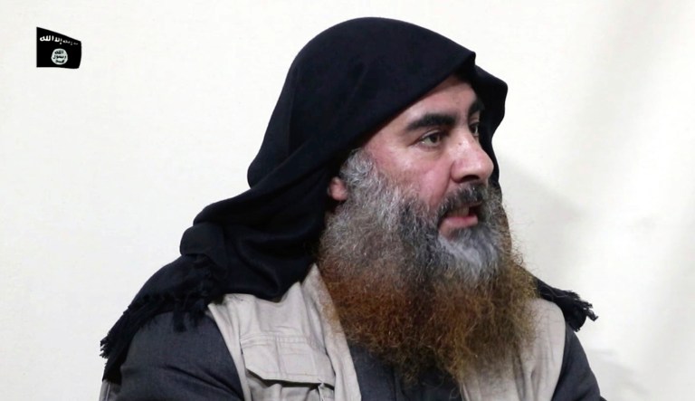 This image made from video posted on a militant website on Monday, April 29, 2019, purports to show the leader of the Islamic State group, Abu Bakr al-Baghdadi, being interviewed by his group's Al-Furqan media outlet. Al-Baghdadi acknowledged in his first video since June 2014 that IS lost the war in the eastern Syrian village of Baghouz that was captured last month by the Kurdish-led Syrian Democratic Forces. 